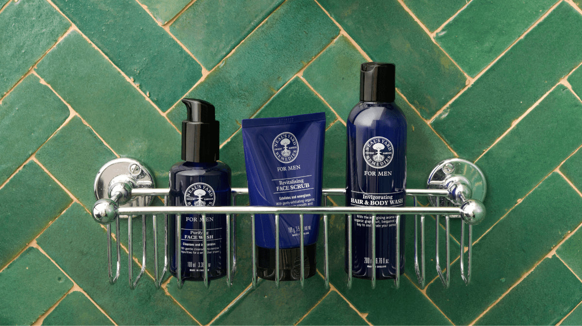 Neal's Yard Remedies men's skincare products inside a shower shelf