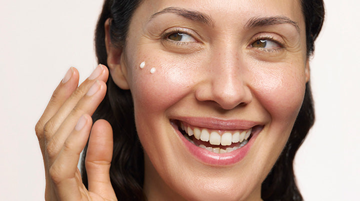 Lady applying Frankincense Intense Lift Eye Cream