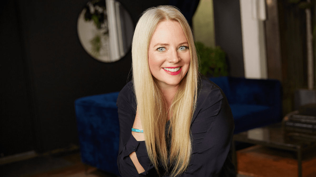 Lisa Shelley sitting and smiling at the camera