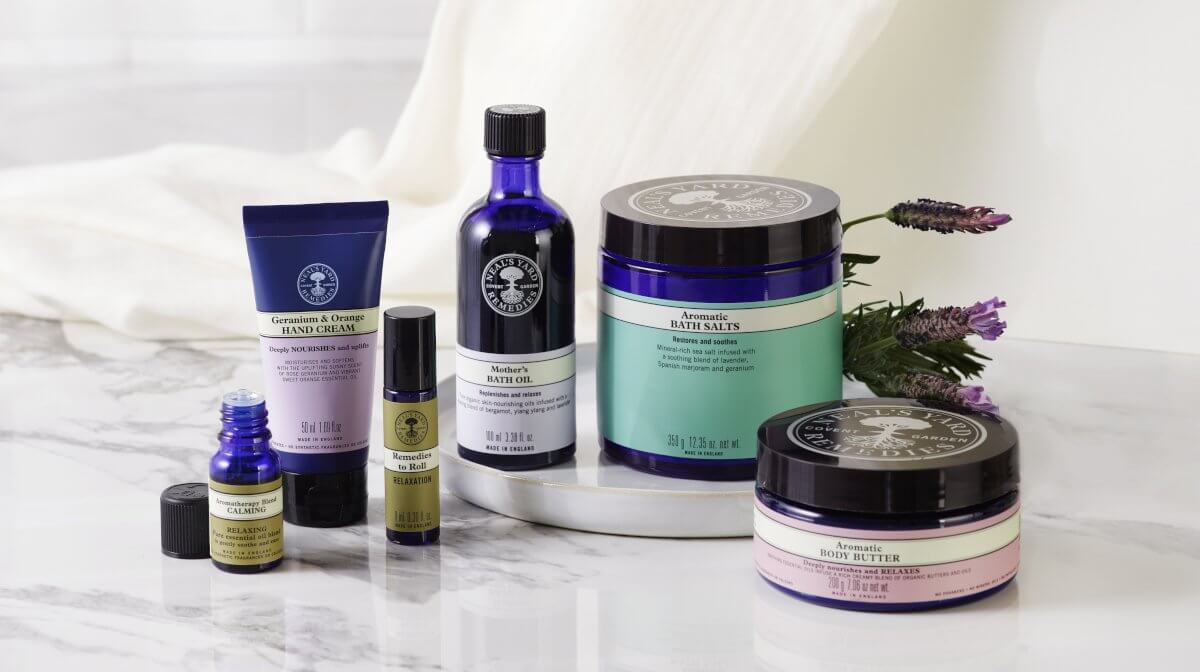 Neals Yard Remedies products on a marble counter with lavender behind them