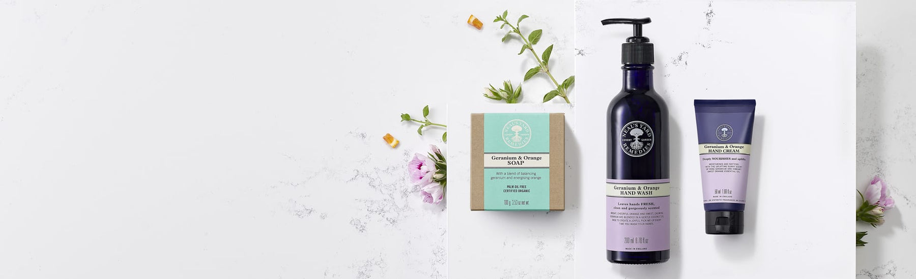 Picture of three hand care products surrounded with botanicals by Neal's Yard Remedies