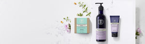 Picture of three hand care products surrounded with botanicals by Neal's Yard Remedies
