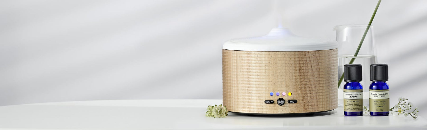 Picture of a diffuser and a couple of aromatherapy essential oils by Neal's Yard Remedies