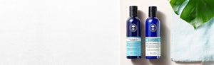 Picture of a bottle of shampoo and a conditioner by Neal's Yard Remedies