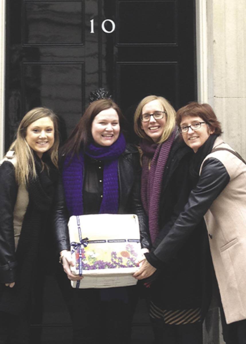 Picture of four women in front of Number 10 holding a petition box from Neal's Yard Remedies