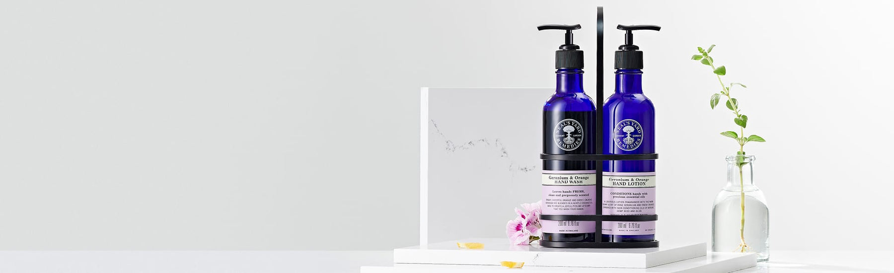Picture of a hand wash and lotion set in a caddy by Neal's Yard Remedies