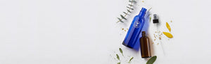 Picture of the iconic blu bottle, amber bottle and pump atomiser by Neal's Yard Remedies