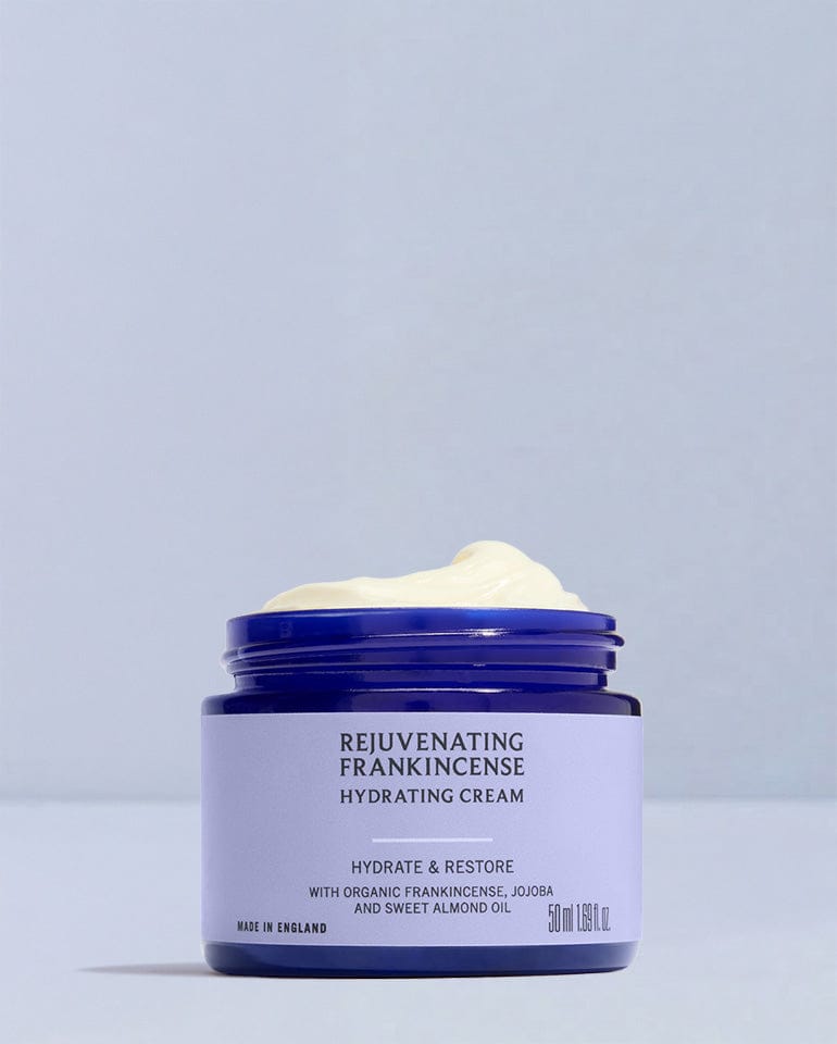 Jar of Rejuvenating Frankincense Hydrating Cream on a light gray background