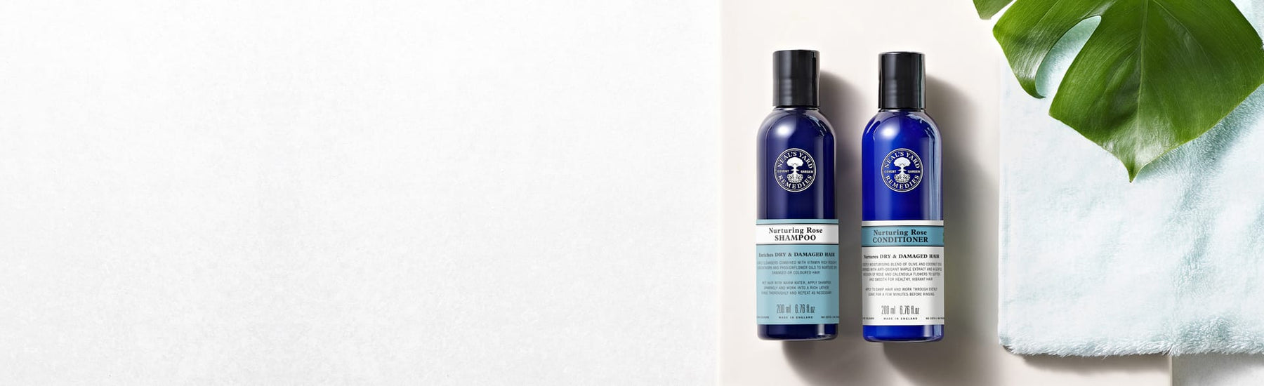 Picture of a bottle of shampoo and a hair conditioner by Neal's Yard Remedies