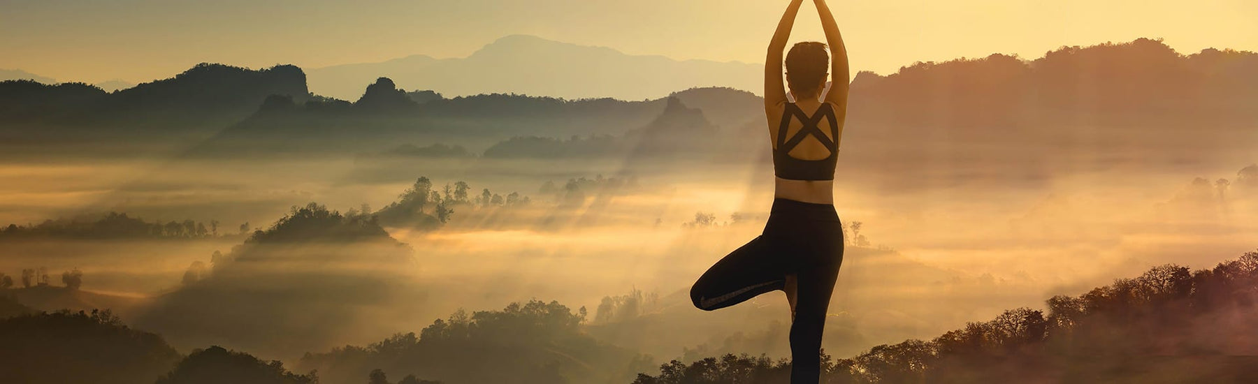 Picture of a woman practicing yoga in the nature