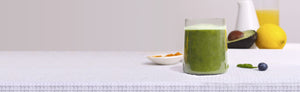 Picture of a green smoothie, lemon and avocado