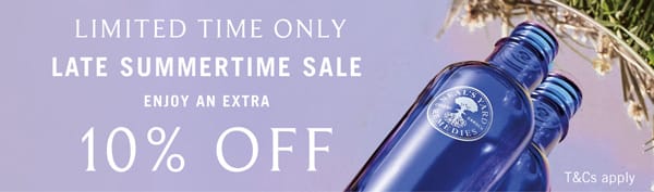 Promotional sale banner with text reading 'LIMITED TIME ONLY LATE SUMMERTIME SALE ENJOY AN EXTRA 10% OFF' over a lavender background, alongside blue glass bottles and dried flowers.