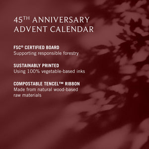 Promotional graphic for the 45th Anniversary Advent Calendar, featuring white text on a dark burgundy background with soft leaf shadows. Text highlights FSC certification, sustainable printing with 100% vegetable-based inks, and compostable Tencel ribbon.