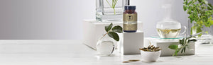 Picture of a supplement surrounded with glass decor and herbs by Neal's Yard Remedies