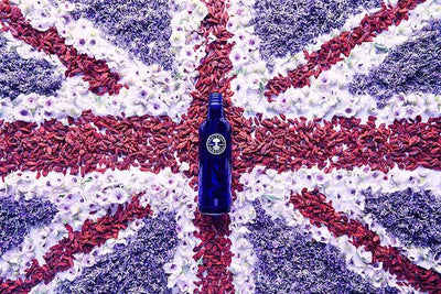 Picture of the flag of United Kingdom and the iconic blue bottle by Neal's Yard Remedies